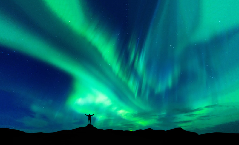 Aurora borealis in Iceland with silhouette